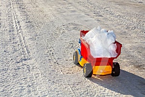 Toy truck removes snow in winter