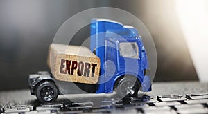 Toy truck with wooden block with word Export on it. Concept for international business, logistics, transpot, freight