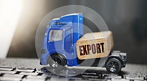 Toy truck with wooden block with word Export on it. Concept for international business, logistics, transpot, freight company