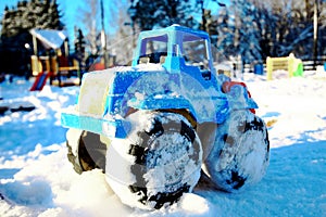 Toy vehicle in snow winter background cold weather