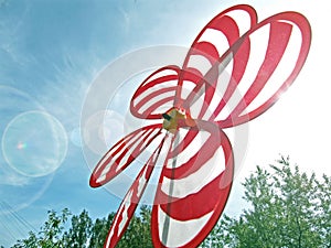 Toy windmill on a bright day