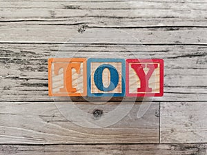 Toy. Toy word from wooden letter blocks