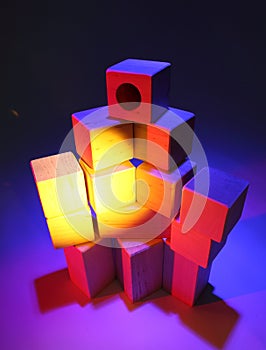Toy bricks in colored light