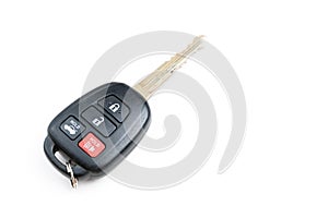 A Toyota car key is isolated on a white background. Close up