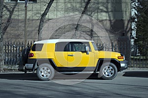 Toyota Land Cruiser yellow car.