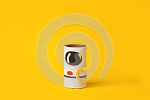 Toys astronaut on yellow background with copy space for text. Concept of business launch, start up, handcraft, diy, creative idea