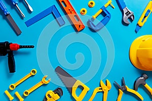 Toys background. Top view of toy tools on blue background