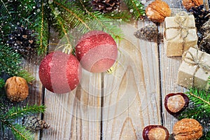 Toys for the Christmas tree and pine cones on old wooden background new Year