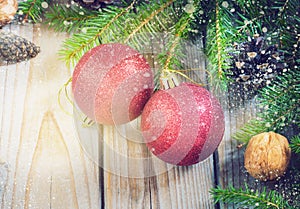 Toys for the Christmas tree and pine cones on old wooden background new Year