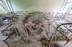 Toys and cots, Kindergarten in Prypiat, Chernobyl exclusion Zone. Chernobyl Nuclear Power Plant Zone of Alienation in Ukraine