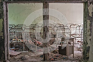 Toys and cots, Kindergarten in Prypiat, Chernobyl exclusion Zone. Chernobyl Nuclear Power Plant Zone of Alienation in Ukraine