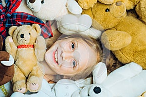 Toys dream. Kid girl dreams near tiys teddy. Childhood dream. Daydreamer child. Dreams and imagination. Dreamy kids photo
