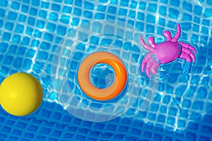 toys floating in swimming pool