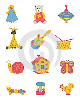 Toys isolated on a white background. There is a doll, a teddy bear, a house, a spindle top, a giraf, a guitar, a drum