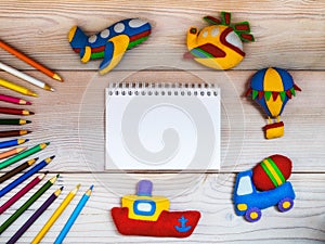 Toys and pencils on the wooden table