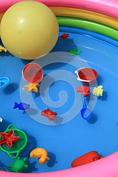 Toys in a pool full of water