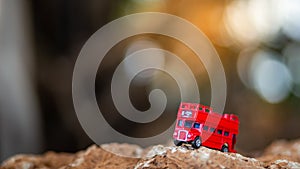 Toys that represent two of the main symbols of the city of London, double-decker bus on blurred background. selective focus and