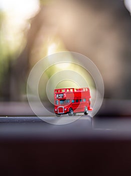 Toys that represent two of the main symbols of the city of London, double-decker bus on blurred background. selective focus and