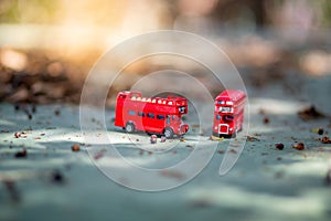 Toys that represent two of the main symbols of the city of London, double-decker bus on blurred background. selective focus and