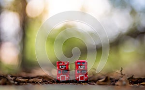 Toys that represent two of the main symbols of the city of London, double-decker bus on blurred background. selective focus and