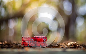 Toys that represent two of the main symbols of the city of London, double-decker bus on blurred background. selective focus and