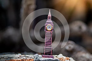 Toys that represent two of the main symbols of the city of London, The London famous Big Ben model on blurred background.