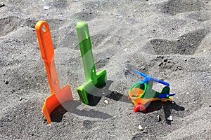 Toys on the sand of the beach in Spain