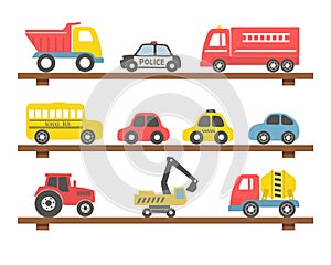 Toys on the shelves. There are different toy cars: firefighters car, truck, police car, taxi, bus, excavator, concrete mixer truck