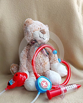 Toys stethoscope , syringe, cat. child`s play in the hospital. injection, treatment, doctor, vaccine