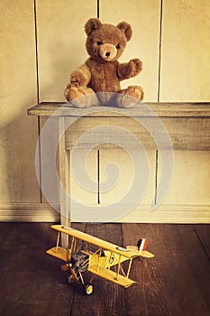 Toys on wooden bench with vintage look photo