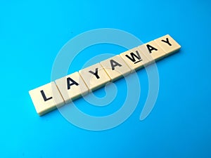 Toys word with the word LAYAWAY on a blue background