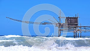 Trabocchi coast in Abruzzo with big waves on rough sea - Italy - a trabucco is an old fishing machines famous in south