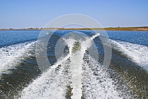 Trace from a boat on the water. Motor boat foamed the water with him