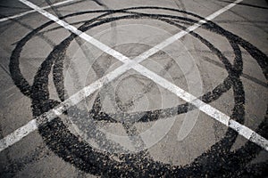 Trace of motorcycle tire on the asphalt in a parking lot