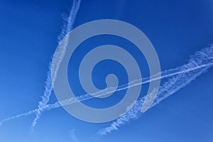 Trace of the plane in the blue sky. Sunny day. Greece.