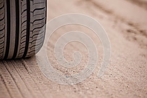 Trace of rubber tires SUV in the desert sand