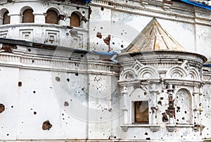 Traces of bullets and shell fragments on the walls of the templ photo
