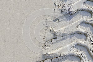 Traces of car tires in the sand. tire tracks on the beach. offroad trophy