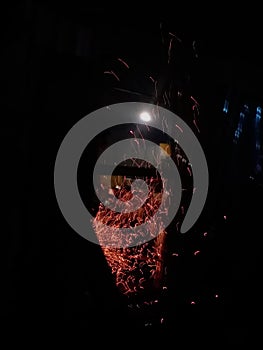 Traces of sparks from the fire at night.