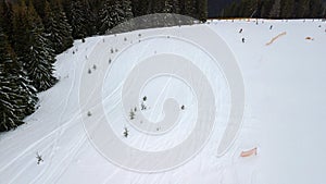 Traces of snowboarders and skiers in the snow in the mountains