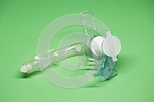 Tracheostomy tube on a green background