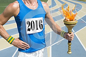 Track Athlete Wearing 2016 Race Bib Holding Torch