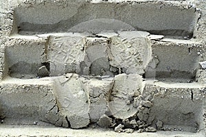 Shoes marks track of bulldozer on the sand