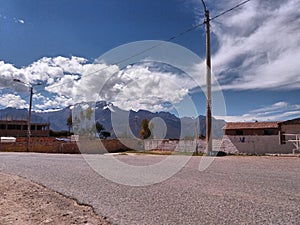 Track and houses with distant snowy photo