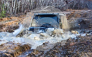 Track on mud. Off road car. Safari. Best off-road vehicles. Jeep crushed into a paddle and picked up a spray of dirt
