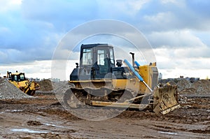 Track-type bulldozer during of large construction jobs at building site.