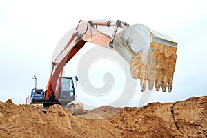 Track-type loader excavator at work