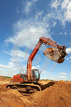 Track-type loader excavator at work