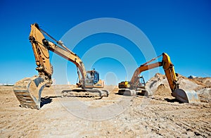 Track-type loader excavators at work