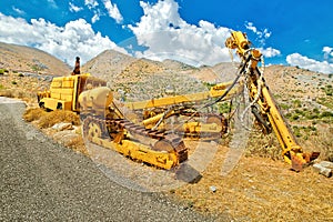 Tracked bulldozer with drilling machine